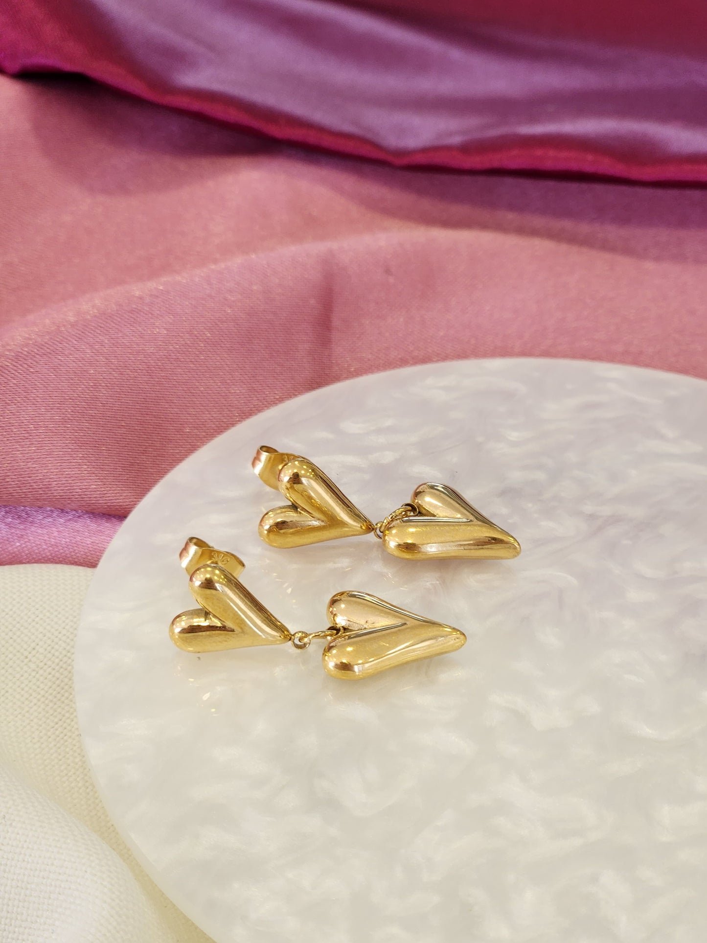 Aretes doble corazon colgante