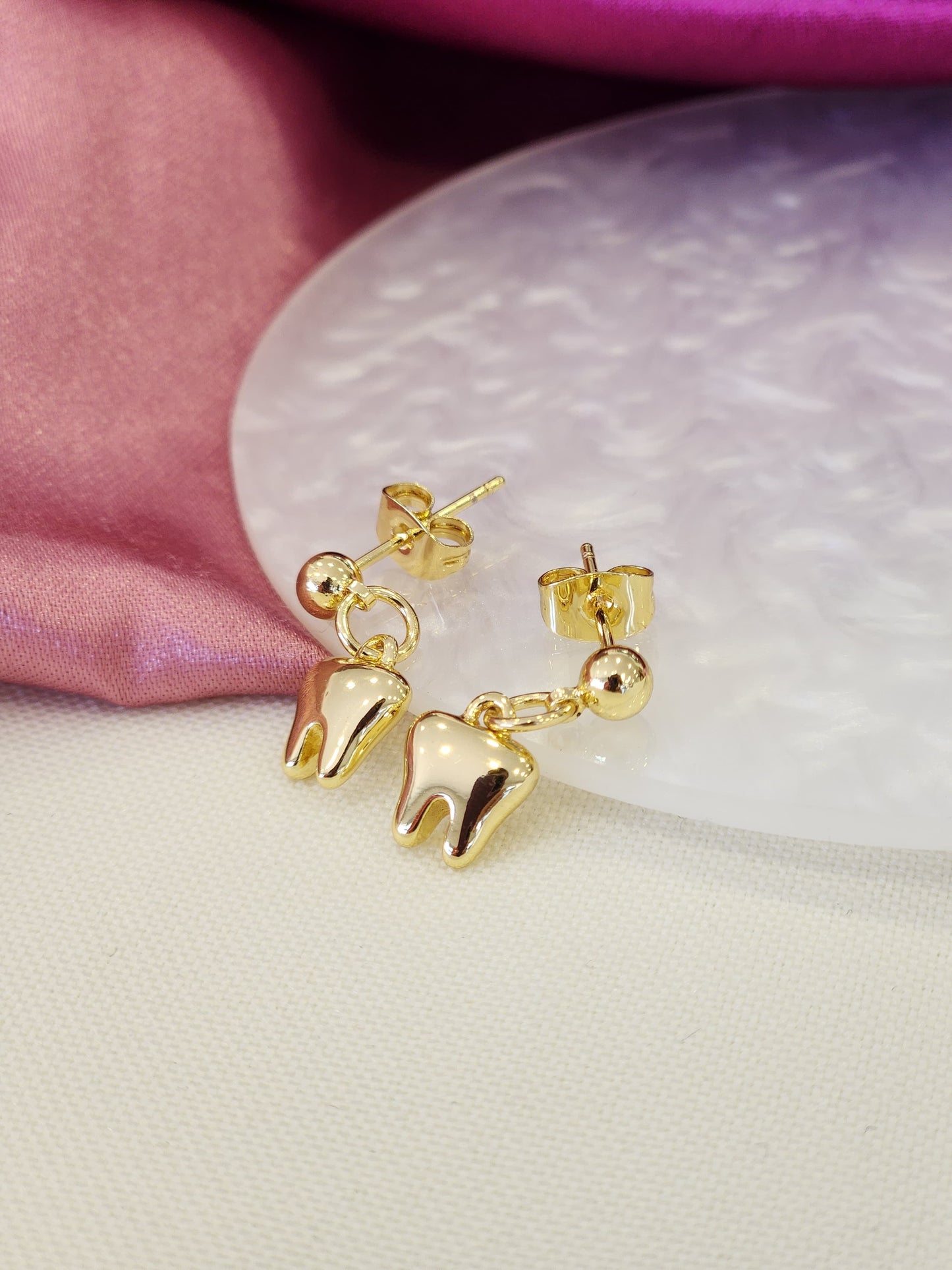 Aretes dientes colgantes