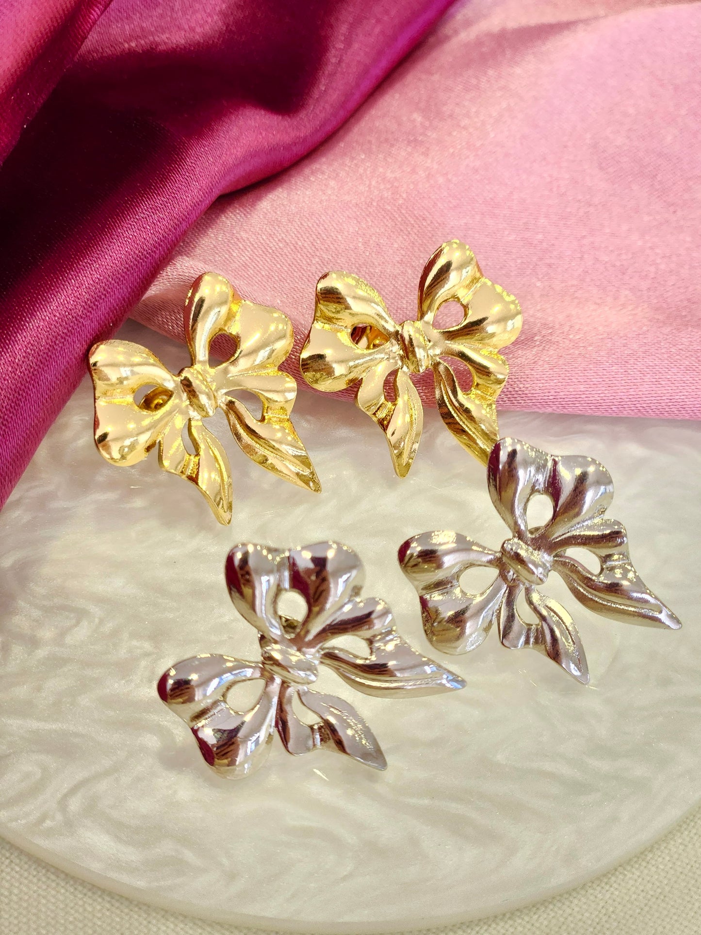 Aretes moño ondulado