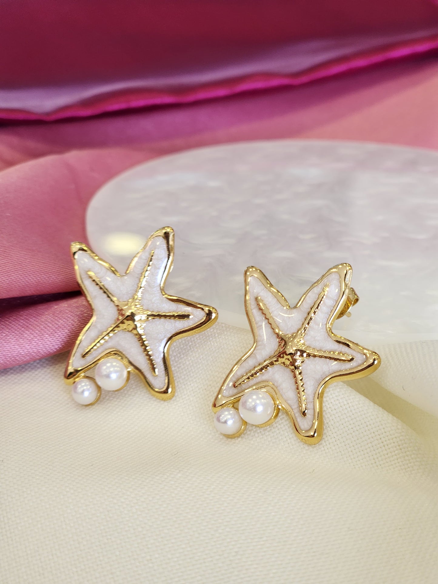 Aretes estrella blanca perla doble