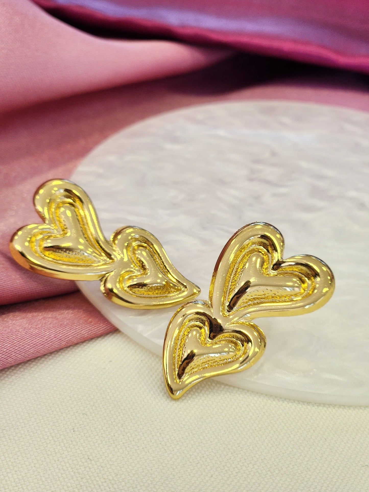 Aretes doble corazon borde al centro #J53