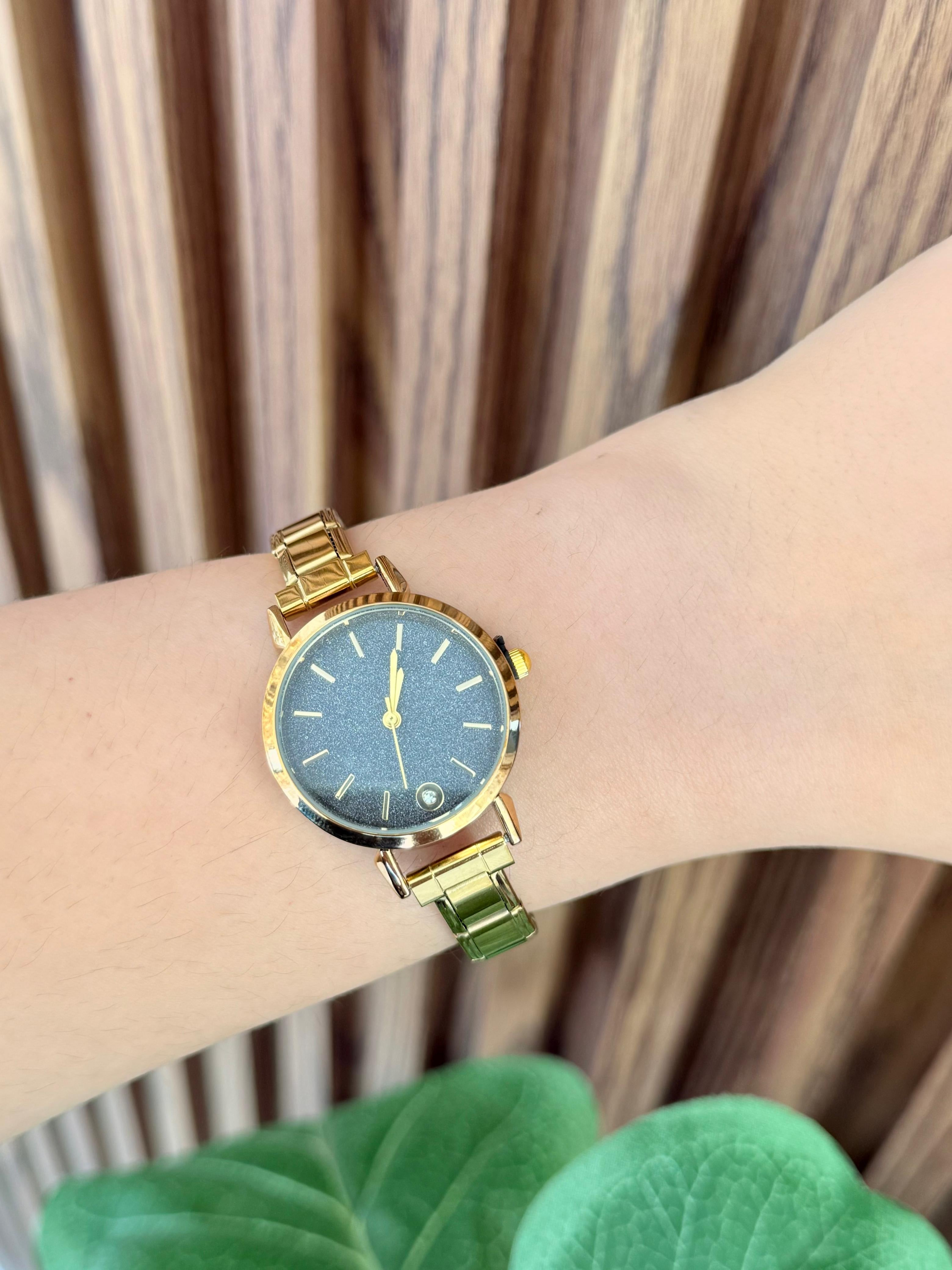 Reloj dorado negro brillos arenoso#B4.7