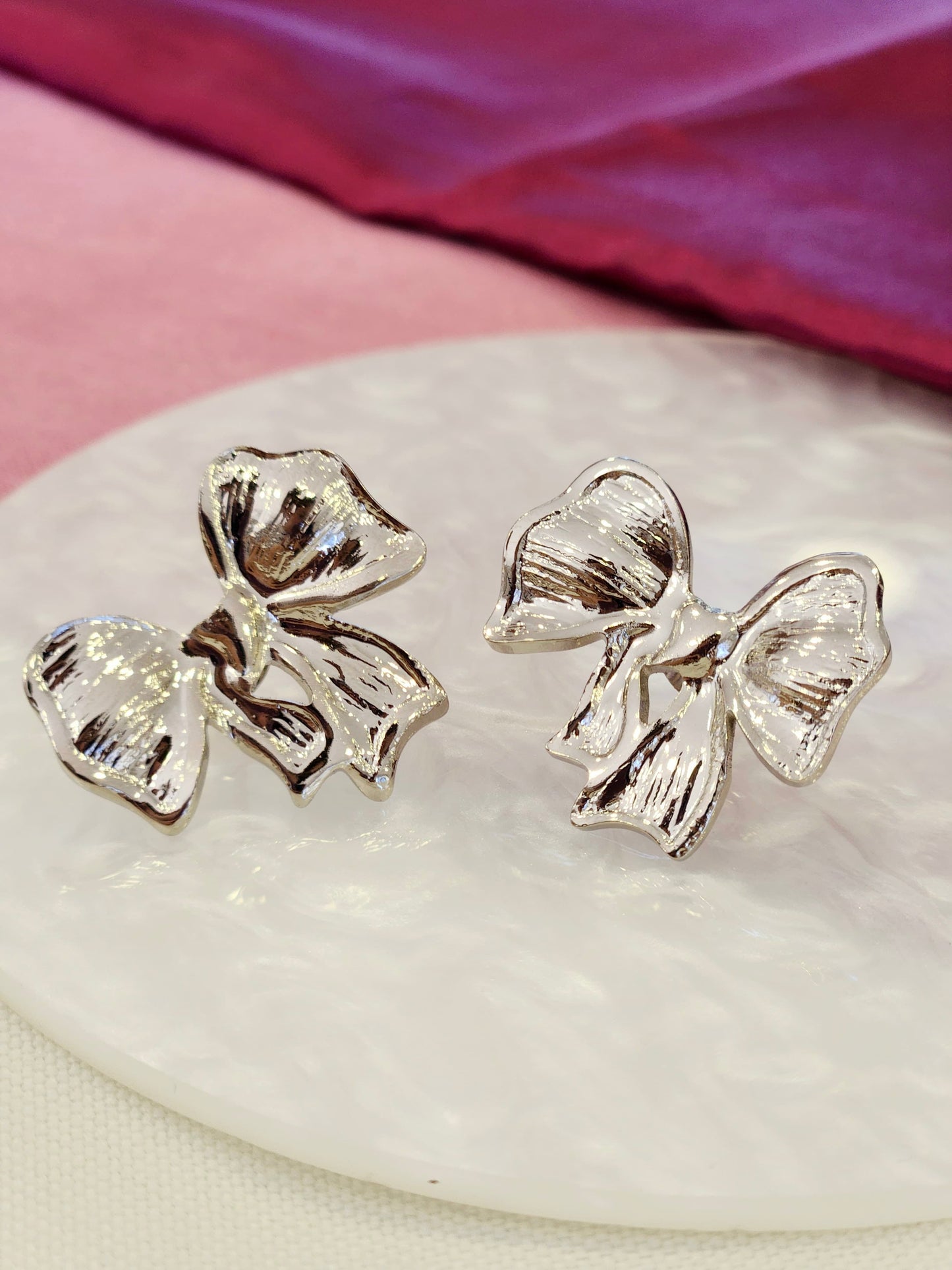 Aretes moños plateados #L29