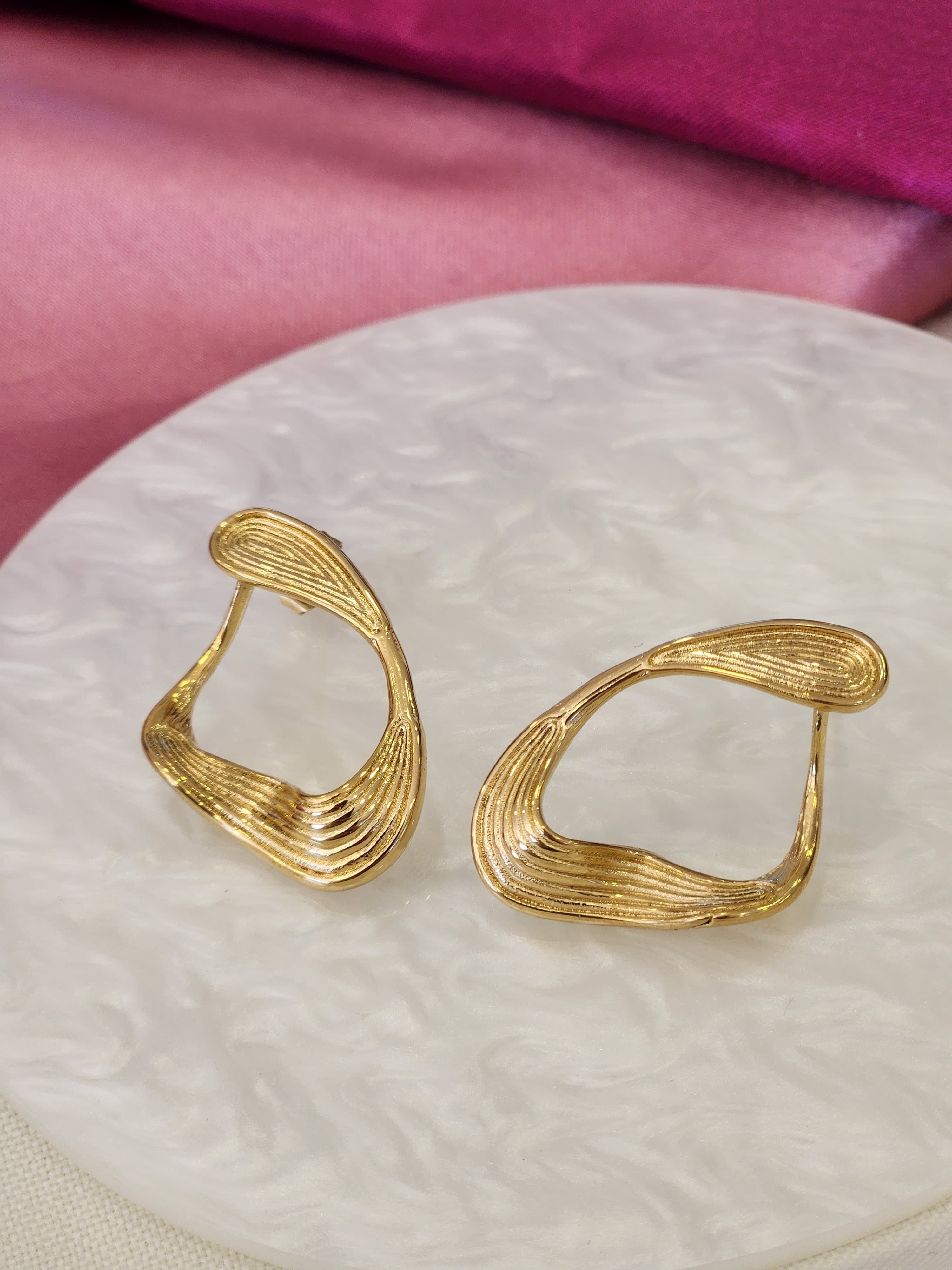 Aretes aretes ovalo torcido lineas #J24