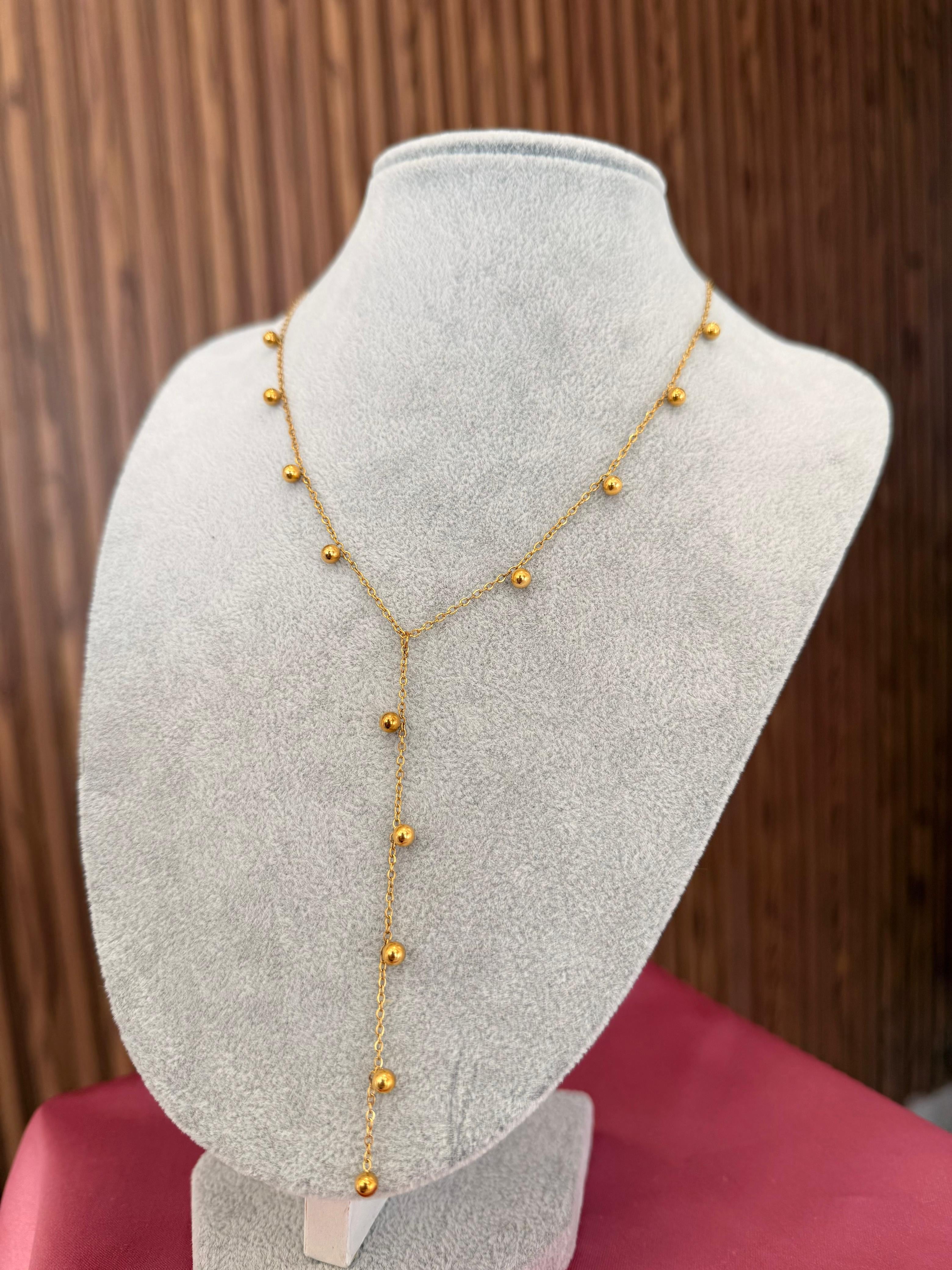 Collar colgante bolitas doradas