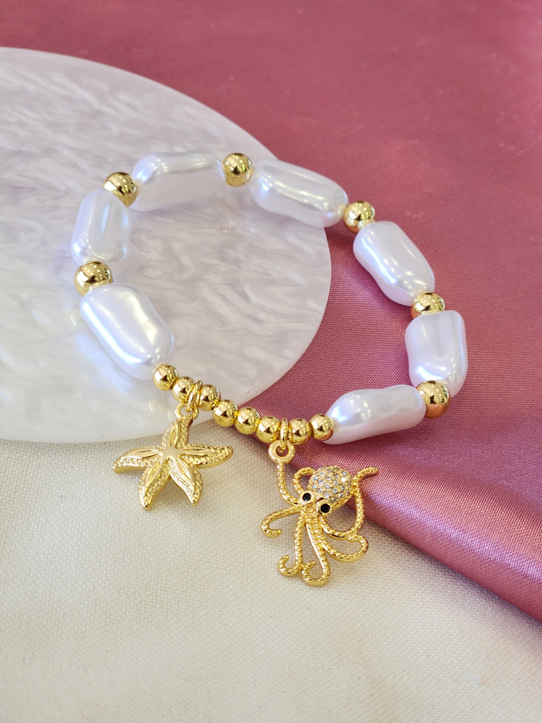 Pulsera perla alargada estrella pulpo #E19