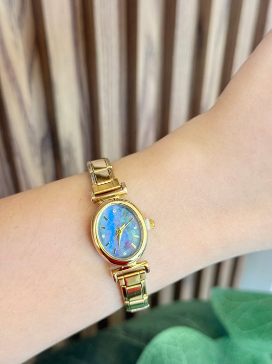 Reloj dorado tornasol ovalado F21