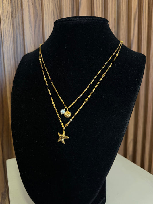 Collar doble con estrella de mar, concha y perla