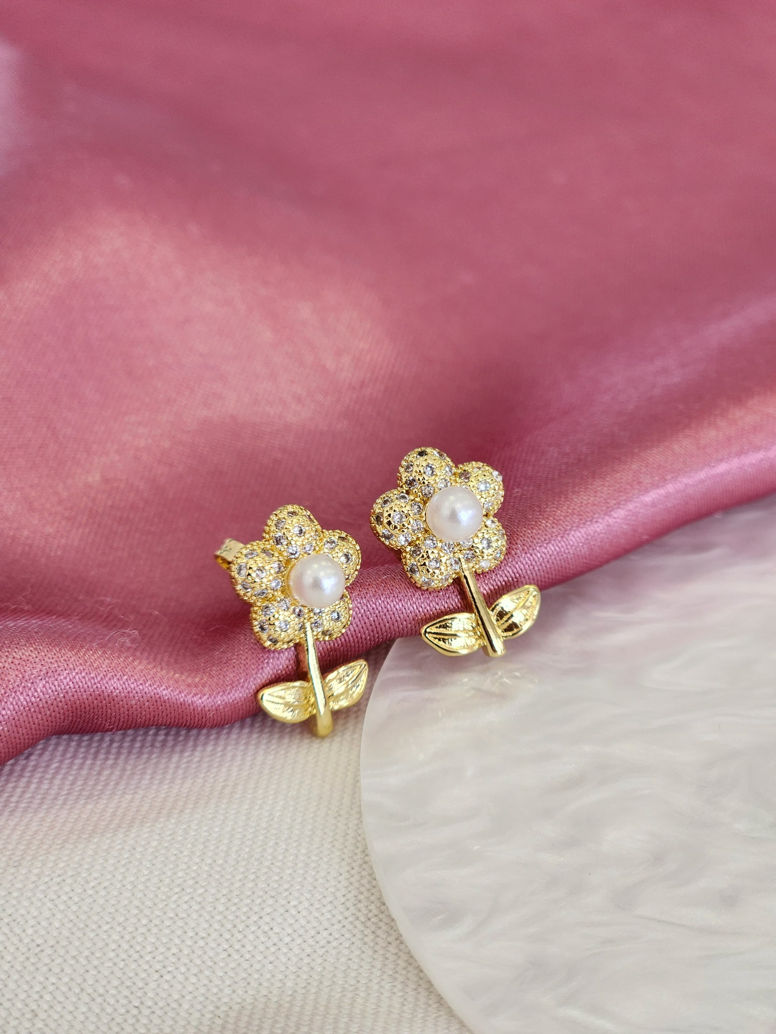 Aretes flor con tallo perla zirconia #82