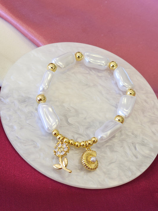 Pulsera perlas alargadas flor concha #F9