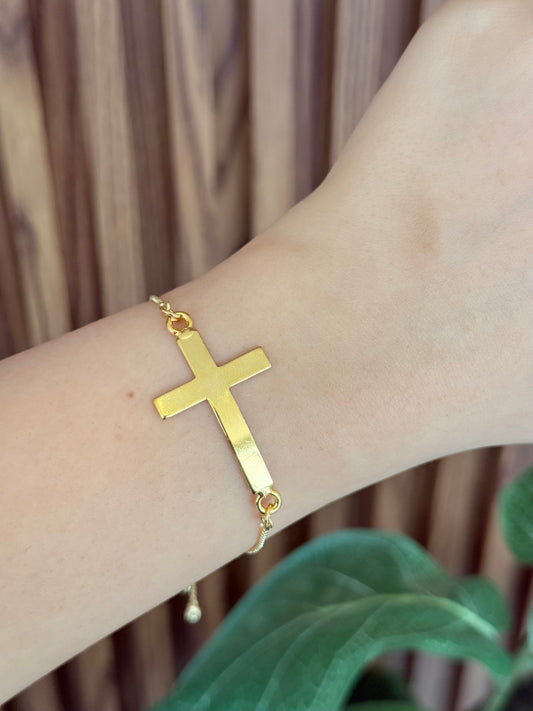 Pulsera cruz alargada dorada
