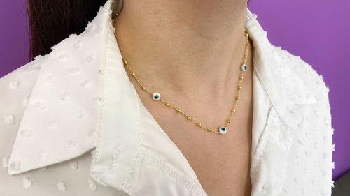 Choker bolitas doradas ojo blanco